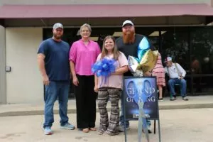 Family standing together at a Legacy Vans community event