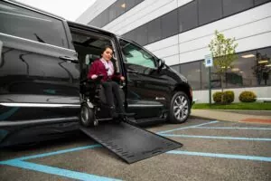 Customer using a wheelchair-accessible van with ramp system