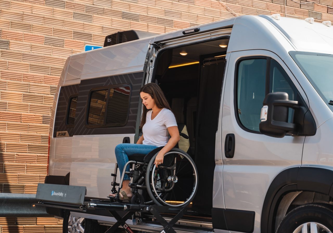 Full-size platform wheelchair lift deployed from a mobility van for safe wheelchair access