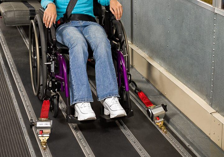 Wheelchair secured inside a vehicle using an electronic wheelchair restraint system
